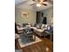 Comfortable living room with a plush sofa, accent rug, and hardwood flooring at 1137 Eagles Nest Cir, Carrollton, GA 30116