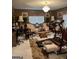 Cozy living room features a chandelier and a comfortable seating arrangement at 1137 Eagles Nest Cir, Carrollton, GA 30116