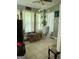 Bright living room with tile floors, sheer curtains, and a large plant at 1137 Eagles Nest Cir, Carrollton, GA 30116