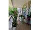 Inviting covered porch featuring a variety of potted plants and decor at 1137 Eagles Nest Cir, Carrollton, GA 30116