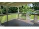 Back porch featuring wood decking and white railings at 1170 5Th Ave, Jonesboro, GA 30236