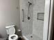 Bathroom with a new tile shower, safety bar, and toilet at 1170 5Th Ave, Jonesboro, GA 30236