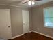Bedroom featuring wood floors and a window with blinds at 1170 5Th Ave, Jonesboro, GA 30236