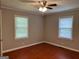 Bright bedroom with hardwood floors and two windows offering natural light at 1170 5Th Ave, Jonesboro, GA 30236