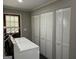 Laundry room with washer, dryer, and lots of storage at 1170 5Th Ave, Jonesboro, GA 30236