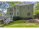 Large backyard with deck and staircase and mature trees at 770 River Cove Dr, Dacula, GA 30019