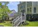 Backyard deck with stairs and lush greenery at 770 River Cove Dr, Dacula, GA 30019