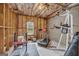 Unfinished basement featuring exposed framing, concrete wall, and fitness equipment at 770 River Cove Dr, Dacula, GA 30019