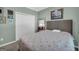 Bedroom with closet space, soft green walls, and carpet at 770 River Cove Dr, Dacula, GA 30019
