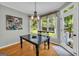 Breakfast nook features black dining table and backyard view at 770 River Cove Dr, Dacula, GA 30019