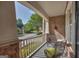 Covered front porch offering a view of the street with comfortable metal seating at 770 River Cove Dr, Dacula, GA 30019