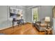 Comfortable home office with hardwood floors, a cozy chair, and natural light at 770 River Cove Dr, Dacula, GA 30019