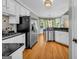 Bright kitchen featuring stainless steel appliances, granite countertops, and a breakfast nook at 770 River Cove Dr, Dacula, GA 30019