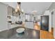 Open concept kitchen with island that connects to the living room area at 770 River Cove Dr, Dacula, GA 30019