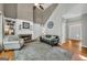 Open living room with fireplace, high ceilings, and hardwood floors at 770 River Cove Dr, Dacula, GA 30019