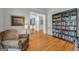 Inviting living room with hardwood floors, a bookshelf, and a comfortable chair at 770 River Cove Dr, Dacula, GA 30019