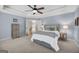 Expansive main bedroom showcases a tray ceiling, plush carpet, and an attached sitting room at 770 River Cove Dr, Dacula, GA 30019