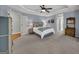 Spacious main bedroom features soft carpeting, a tray ceiling, and decorative furnishings at 770 River Cove Dr, Dacula, GA 30019