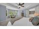 Sunlit main bedroom offers a tray ceiling, plush carpet, an intimate sitting area, and natural light at 770 River Cove Dr, Dacula, GA 30019