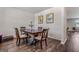 Cozy dining room featuring a wooden dining table and hardwood floors at 600 Dairy Dr, Stockbridge, GA 30281