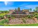 Community entrance showcasing lush landscaping, flowers, and signage, welcoming residents and visitors at 600 Dairy Dr, Stockbridge, GA 30281