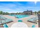 Community pool featuring lounge chairs, tables, and umbrellas offering a relaxing and fun social atmosphere at 600 Dairy Dr, Stockbridge, GA 30281
