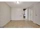 Basement area with tile flooring, a white brick wall, and doors at 323 Newfield Way, Peachtree City, GA 30269