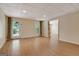 Spacious basement features wood-look floors, neutral walls, and access to the outdoors at 323 Newfield Way, Peachtree City, GA 30269