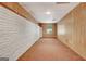 View of the basement with paneled walls and carpet at 323 Newfield Way, Peachtree City, GA 30269