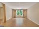 View of the finished basement with wood-look floors and a large window at 323 Newfield Way, Peachtree City, GA 30269