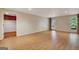 View of the finished basement, featuring a back door and wood-look floors at 323 Newfield Way, Peachtree City, GA 30269