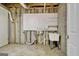 Utility area with sink, exposed brick, and peg board at 323 Newfield Way, Peachtree City, GA 30269