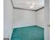 Bedroom showcasing vibrant turquoise carpet, white walls, and classic wallpaper trim at 323 Newfield Way, Peachtree City, GA 30269