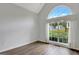 Bright bedroom featuring a large window with natural light and sleek wood floors at 323 Newfield Way, Peachtree City, GA 30269