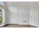 Bedroom featuring bright white walls and a window with backyard views at 323 Newfield Way, Peachtree City, GA 30269