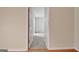 Hallway with door open and tile flooring at 323 Newfield Way, Peachtree City, GA 30269