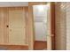 Hallway in finished basement with doors and textured wall covering at 323 Newfield Way, Peachtree City, GA 30269