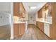 Bright kitchen featuring wood cabinetry and modern appliances, providing a functional cooking space at 323 Newfield Way, Peachtree City, GA 30269