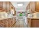 Well-lit kitchen with extensive cabinetry, modern appliances, and breakfast nook area at 323 Newfield Way, Peachtree City, GA 30269