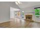Open floor plan living room with vaulted ceilings, fireplace, and plenty of natural light at 323 Newfield Way, Peachtree City, GA 30269