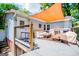 Relaxing deck featuring an orange shade sail and comfortable seating at 527 W Church St, Villa Rica, GA 30180
