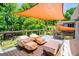 Back deck featuring a shade sail and seating with wooded views at 527 W Church St, Villa Rica, GA 30180