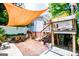 Cozy backyard featuring a patio, shade sail, and upper level deck at 527 W Church St, Villa Rica, GA 30180