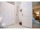 Clean, bright bathroom featuring tiled floors, white fixtures, and a shower-tub combo at 527 W Church St, Villa Rica, GA 30180