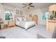 Spacious primary bedroom with a neutral color scheme, multiple windows, and carpet for a comfortable atmosphere at 527 W Church St, Villa Rica, GA 30180