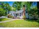 Cozy home featuring a brick chimney, and lush front lawn at 527 W Church St, Villa Rica, GA 30180