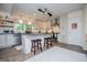 Charming kitchen featuring an island with seating, stainless steel appliances, and bright natural lighting at 527 W Church St, Villa Rica, GA 30180