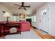 Bright living room featuring hardwood floors, a ceiling fan, and a cozy atmosphere at 527 W Church St, Villa Rica, GA 30180