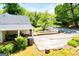 Large parking area with a partial view of the backyard, white fence, and mature trees at 527 W Church St, Villa Rica, GA 30180