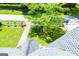 View from the roof showing a well-manicured lawn, mature shade tree, and a charming picket fence at 527 W Church St, Villa Rica, GA 30180